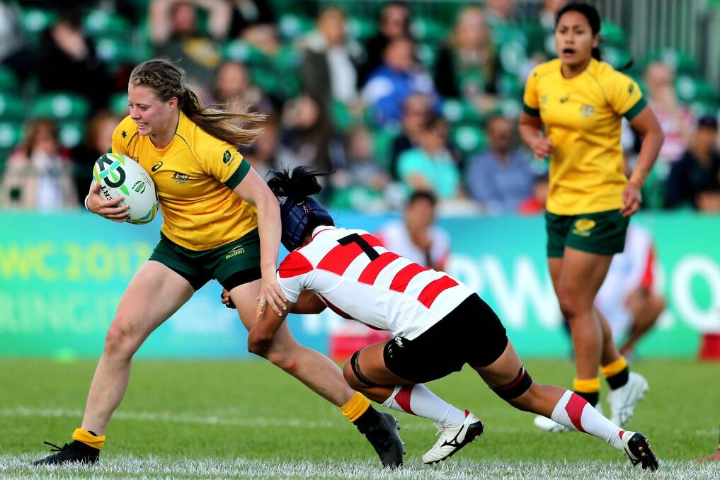 Recovery: Samantha Treherne is tackled by Sayaka Suzuki in their Women's Rugby World Cup pool match. Picture: INPHO/James Crombie