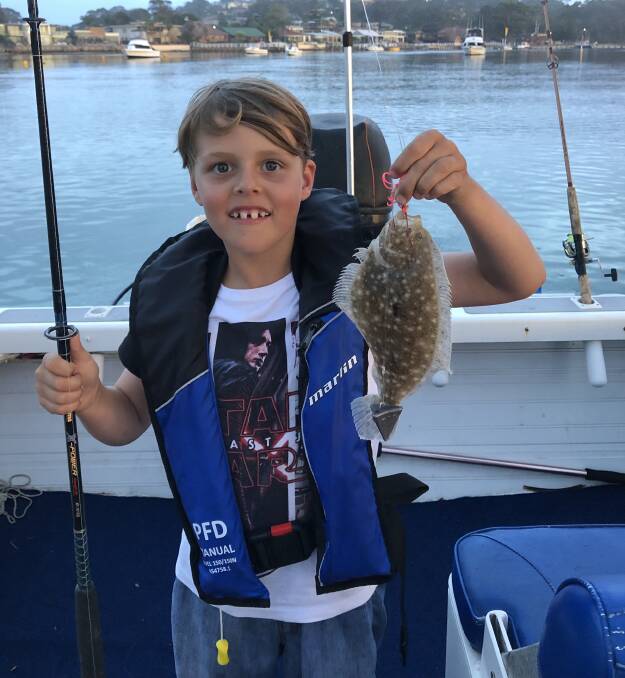 Well caught sir!: Club member eight-year-old Kade Jenkins of Berrambool shows his lovely spotted flounder taken in Merimbula Lake recently.