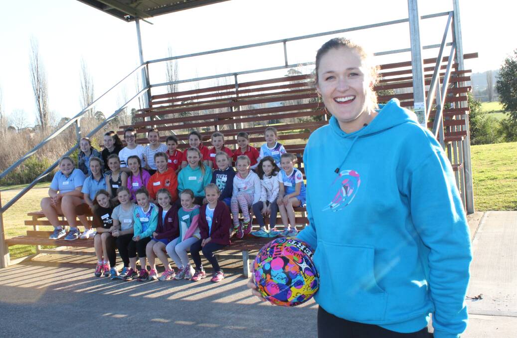 Susan Pettitt with a group of Bega girls during a netball training clinic at the grand stand named in Susan's honour. 