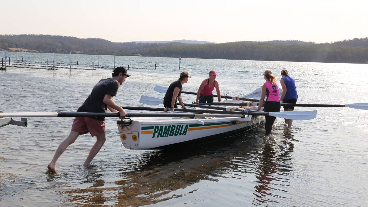 Some of the Pambula ladies team launch surfboat 'The Don' on a windy afternoon for a training session on Merimbula Lake recently. 