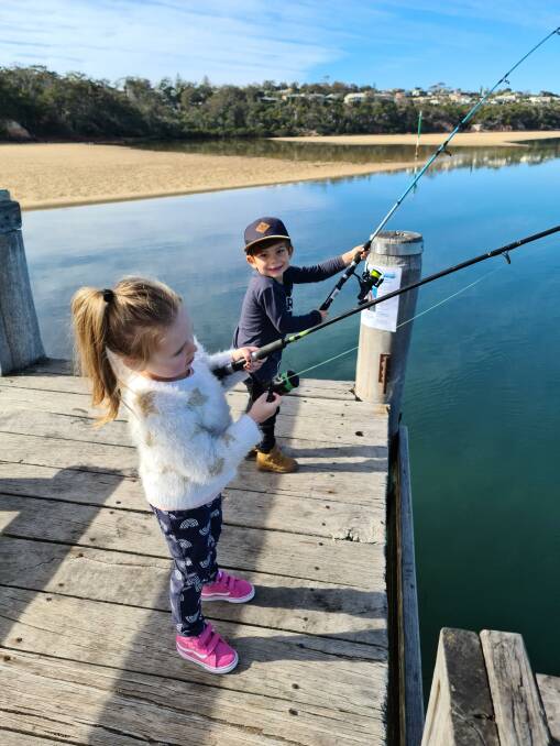 Ella Bourke, 4, and Zepher White, 3, fishing for trevally, bream and flathead from the MBGLAC jetty during the winter holiday junior fishing competition. 
