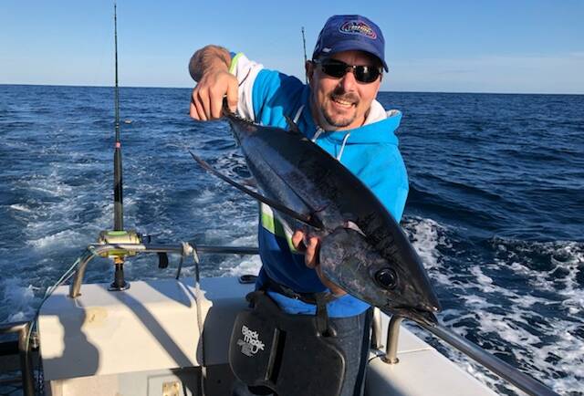 Great day out: Club member Harley Jenkins of Berrambool holds his first ever caught albacore (longfin tuna), one of a number boated last Tuesday off Merimbula.