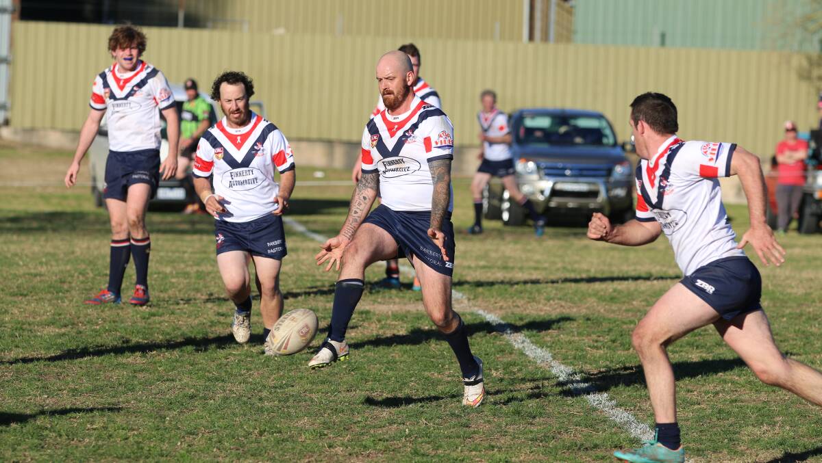 On the ball: Clay Childs taps a little grubber kick during an appearance for the first grade Roosters last year with the Bega Club to feature heavily in Saturday's Nines draw. 