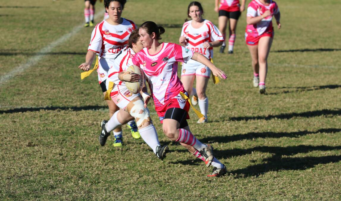 Quick step: Pink Panthers half Caitlin Johnson puts on a burst against the Eden Tigerettes late in the 2016 season. 