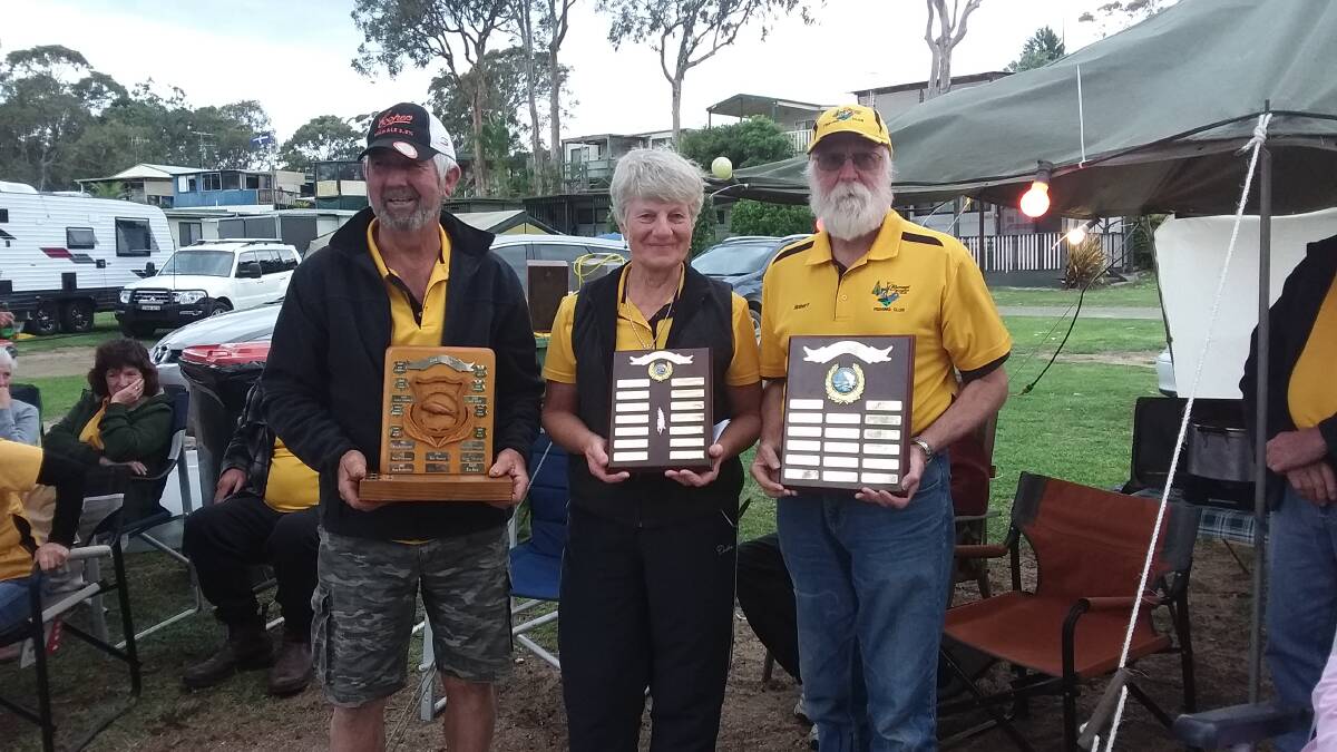 The Bermagui Social Fishing Club's annual prize winners accept their trophies during the annual Christmas camp. 