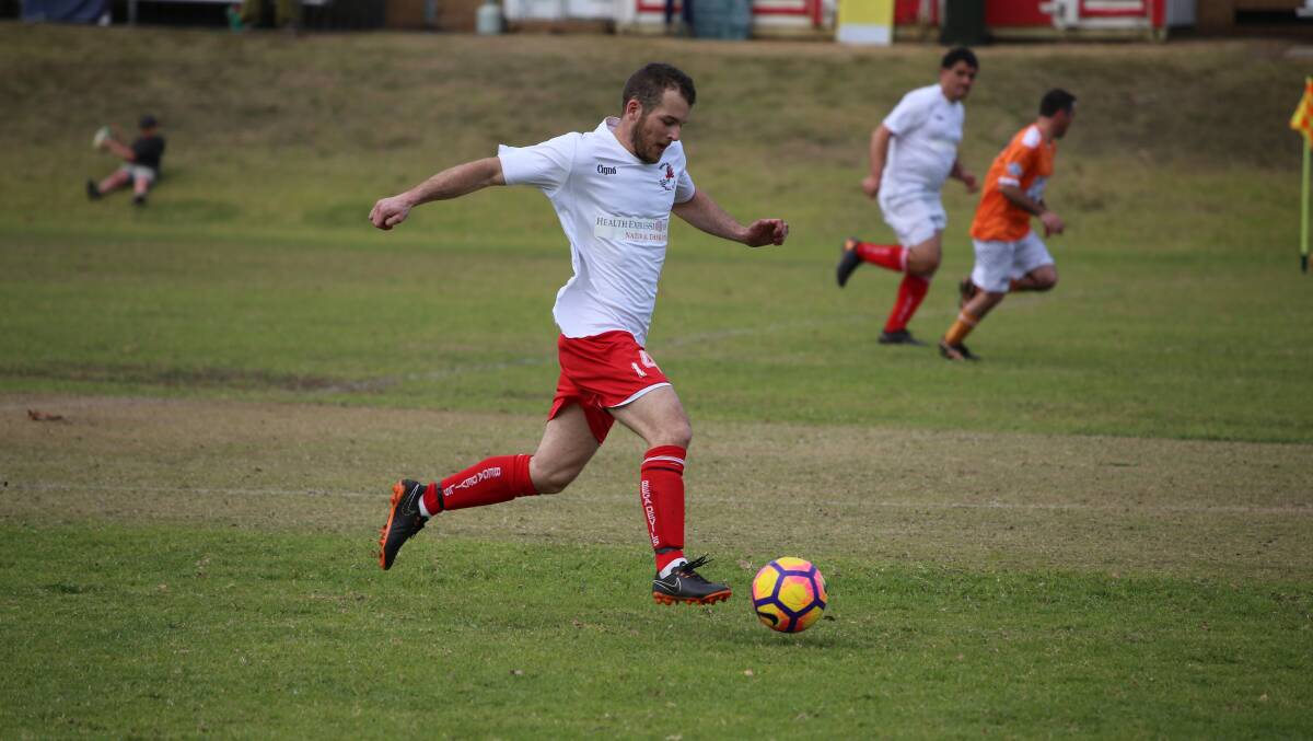 Home derby: A Bega Devils White player runs the ball during a recent clash with Pambula. The Whites took on Bega Red at the weekend. 