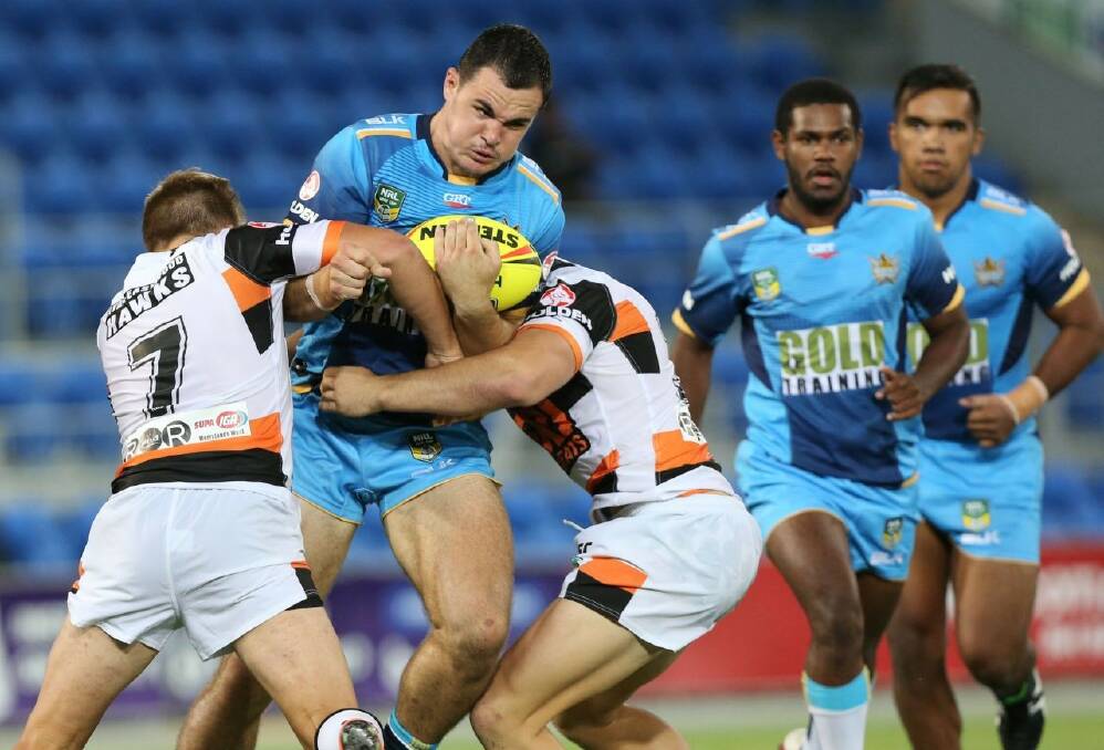 Titans front-rower Morgan Boyle hits up against a pair of Tigers and will train alongside Jarryd Hayne after a record signing this week. 