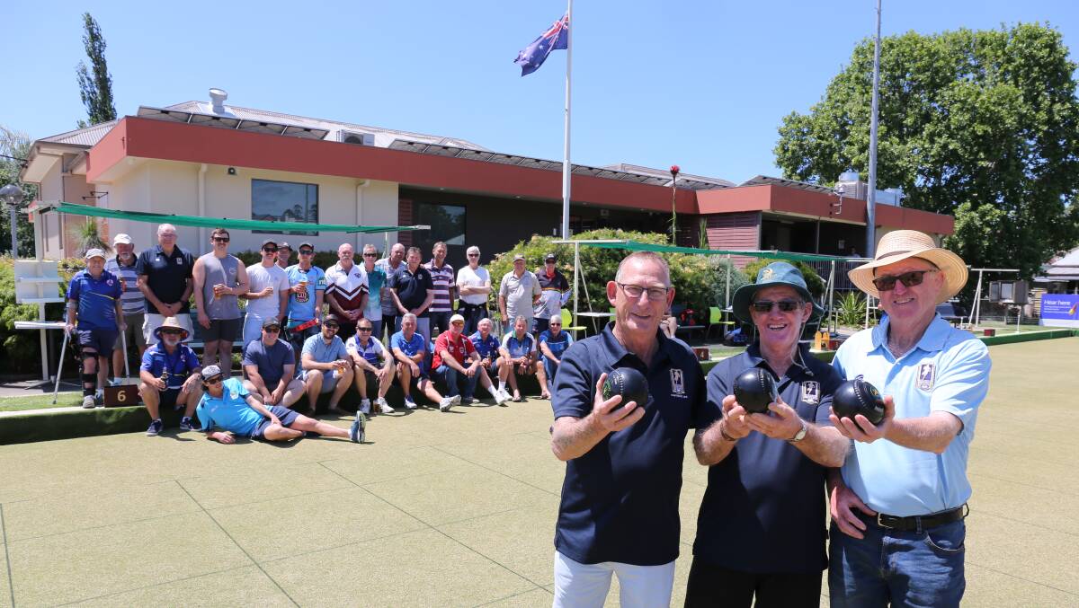 Good show: Men of League officials Col Clarke, Frank Daveys and Dave "Crocket" Reardon with players at the charity bowls day on Sunday. 