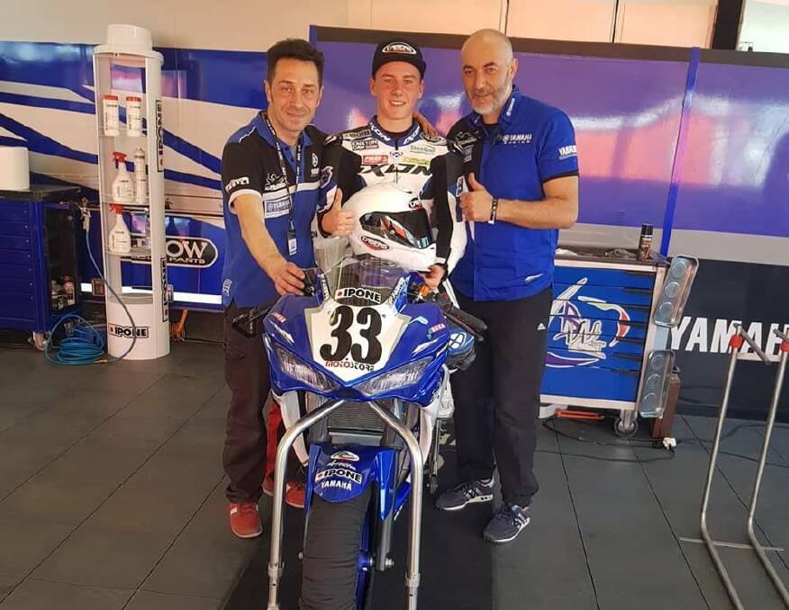 Race one: Bermagui's Reid Battye with Italian team officials ahead of race one at Misano World Circuit over the weekend. Picture: Instagram