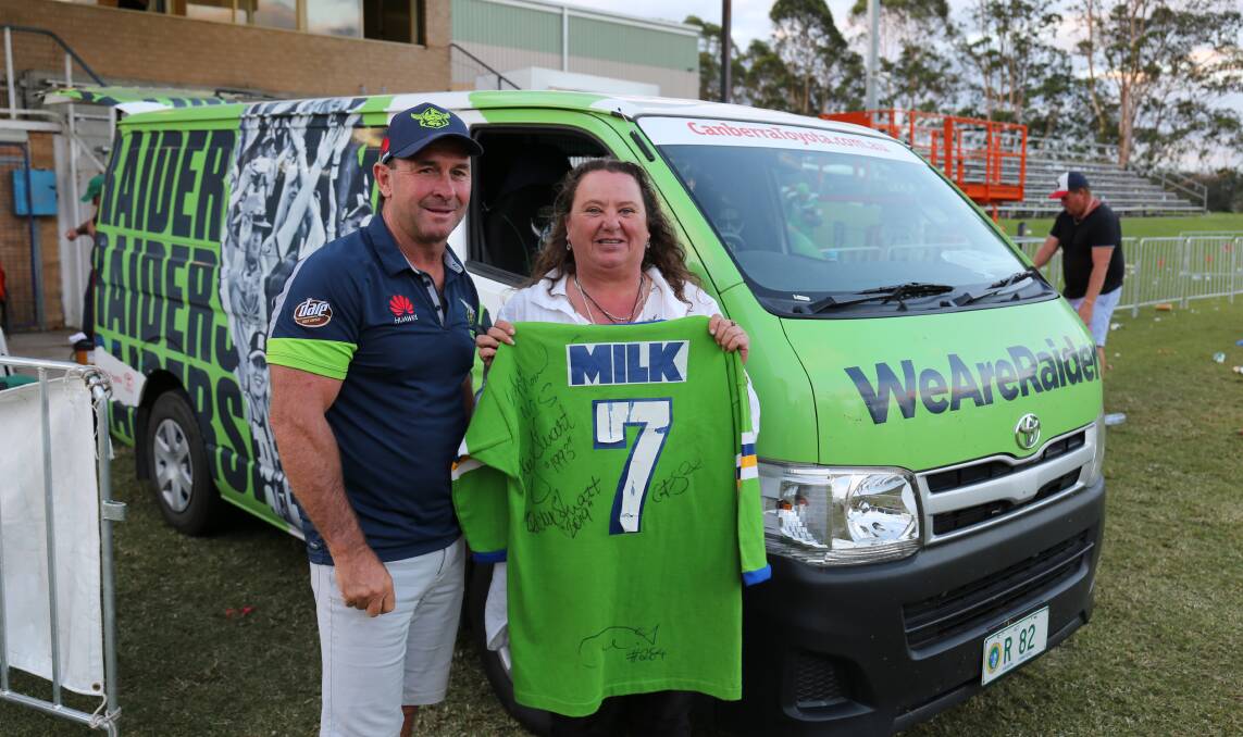 Canberra Raiders coach Ricky Stuart, pictured after signing Jody Lloyd's 1993 jersey, is anticipated to be among Raiders in Cobargo Friday afternoon.