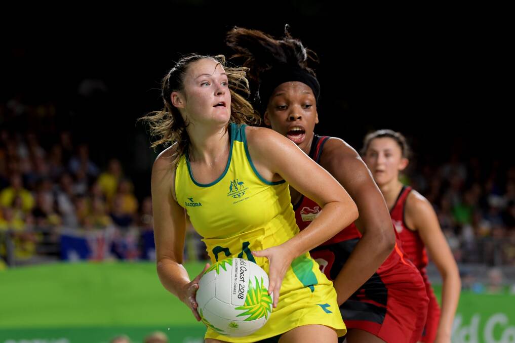 End of an era: Susan Pettitt, pictured guarding the ball during the Commonwealth Games, will retire from netball at the end of the season with the Giants. Picture: AAP.