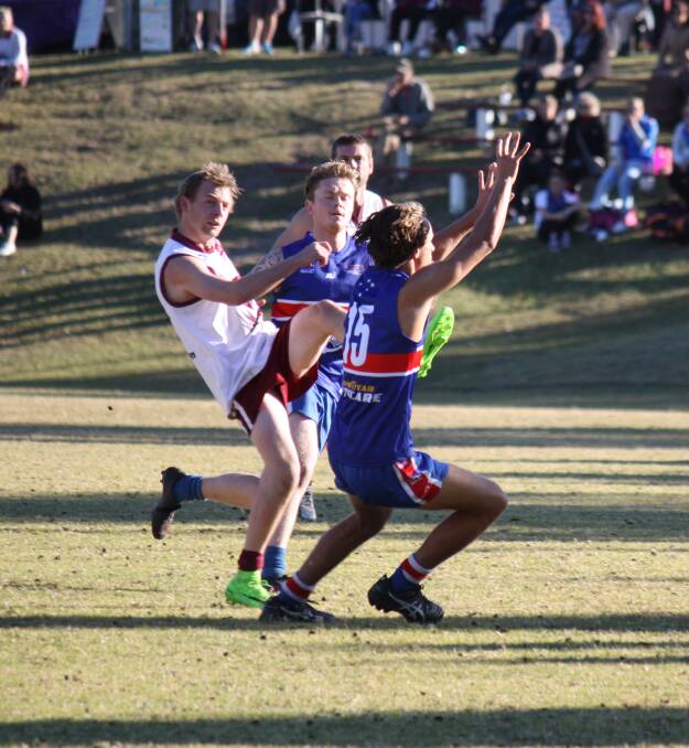 Clear out: Chris Dwyer gets a kick away over his Merimbula opponent recently with the Eagles and Diggers to clash again on Saturday. 