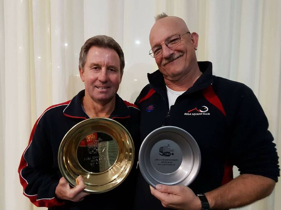 Country's best: Sheep Thatcher and Baden Edwards with their respective shields from the Australian Masters Squash Championships in Ballarat over the weekend. 