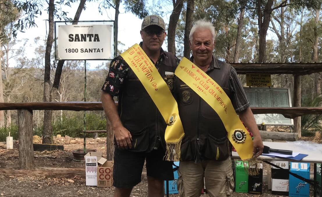 Bermagui sporting clays club champions Rob Shaw and Bernie Parker celebrate during the sash presentation. 