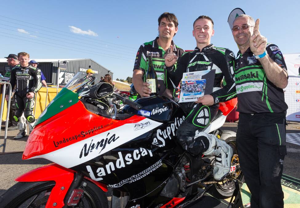 Australian super bike champ: BC Performance team manager Kelvin Reilly and crew chief Ronnie Granger congratulate Reid Battye on his result at Sydney's Motorsport Park last weekend. Picture: Keith Muir.