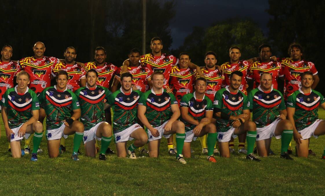 fan favourite: Members of the Indigenous v All Star clash last year pose ahead of the headline match. Picture: Jacob McMaster