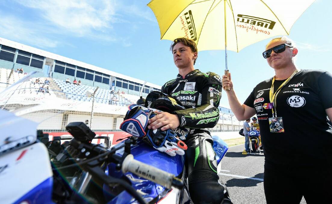 On course: Reid Battye on the grid with Mum, Renee during his wild card race in Jerez, Spain. Picture: Facebook. 