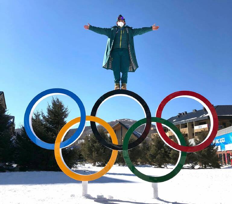 Cooper Woods perched above the Olympic rings in Beijing where he has finished sixth in the moguls. Picture: Instagram. 