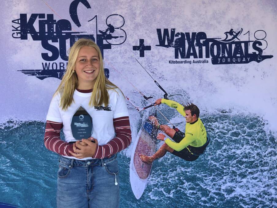 Top spot: Ashley Brunette accepts the junior girls trophy at the Kiteboarding Wave Nationals in Torquay. Picture: supplied. 