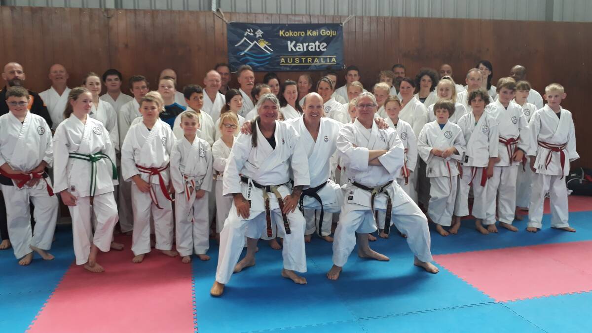 Strong group: Kokoro Kai Goju instructors at front with their students on the annual training camp trip away recently. 