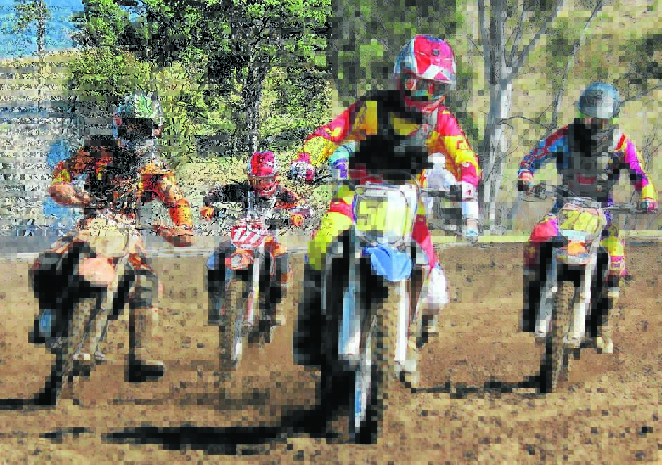 Riders kick up a bit of mud during the South Coast Cup meet held recently at the Sapphire Speedway track. 