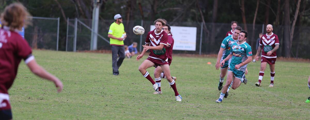 A Tathra player sends a pass down the line during a recent outing. 