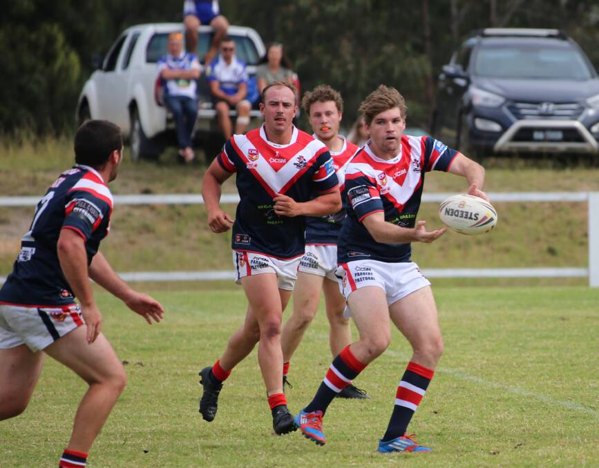 Structure: Scott Fuller sends a pass down the line for the Roosters with the tri-colours edging Narooma by a late try on Sunday. 
