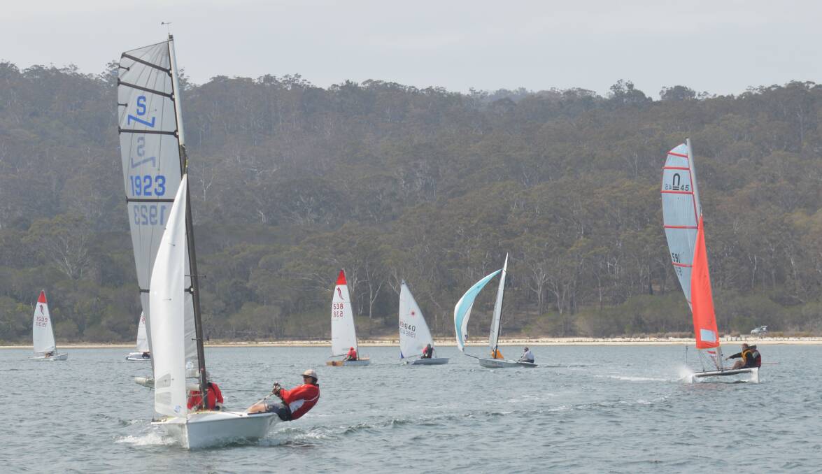 Full sail: The Wallagoot fleet round the boy and turn onto the windward leg in one of the point-score races on Saturday. Picture: Tony Hastings. 