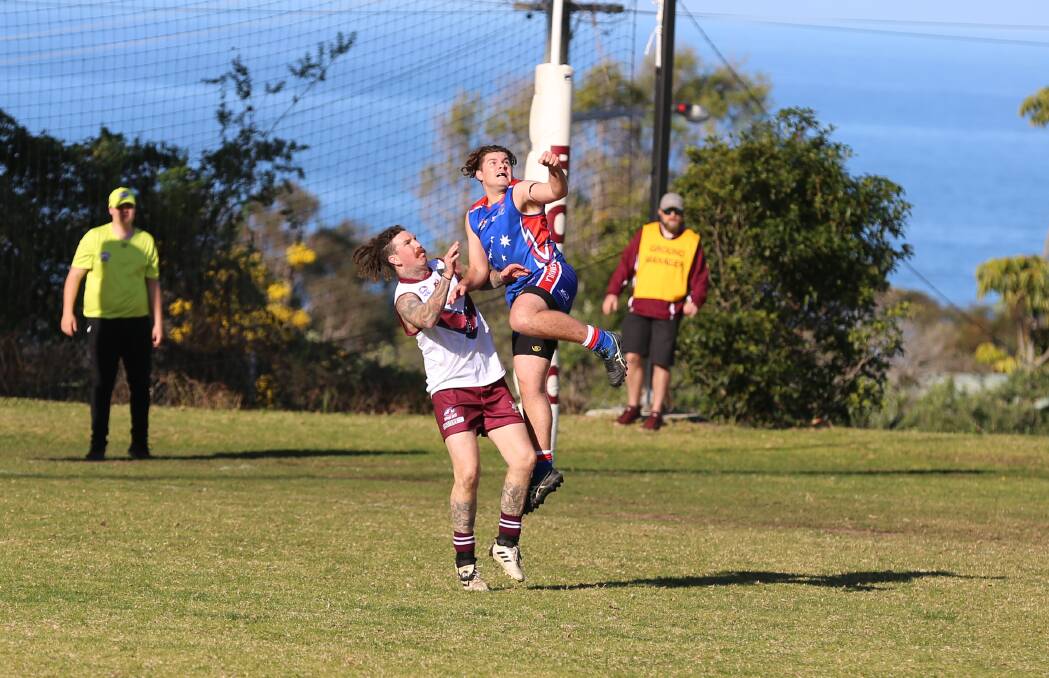 Tathra forward Clinton Phillips shapes for a mark contest with a Merimbula Diggers opponent on Saturday before kicking four goals to lead the tally. 