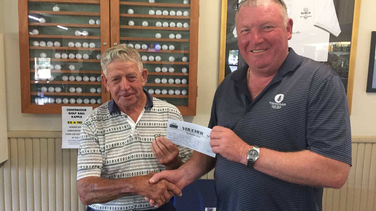 Bega men's golf president Simon Owen congratulates Eddie Collins on his win in the C grade over the weekend, that included the day's best score.
