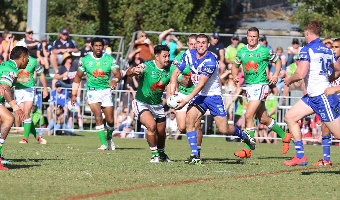 Homegrown hero: Bulldogs Lock Adam Elliott looks for an offload as he crashes into the Canberra Raiders line on Saturday. Picture: Jacob McMaster. 