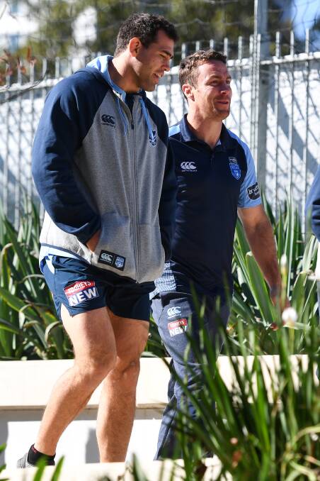 Cool cats: Dale Finucane and James Maloney share a laugh and were staying pretty cool ahead of Wednesday's Origin decider. Picture: AAP. 