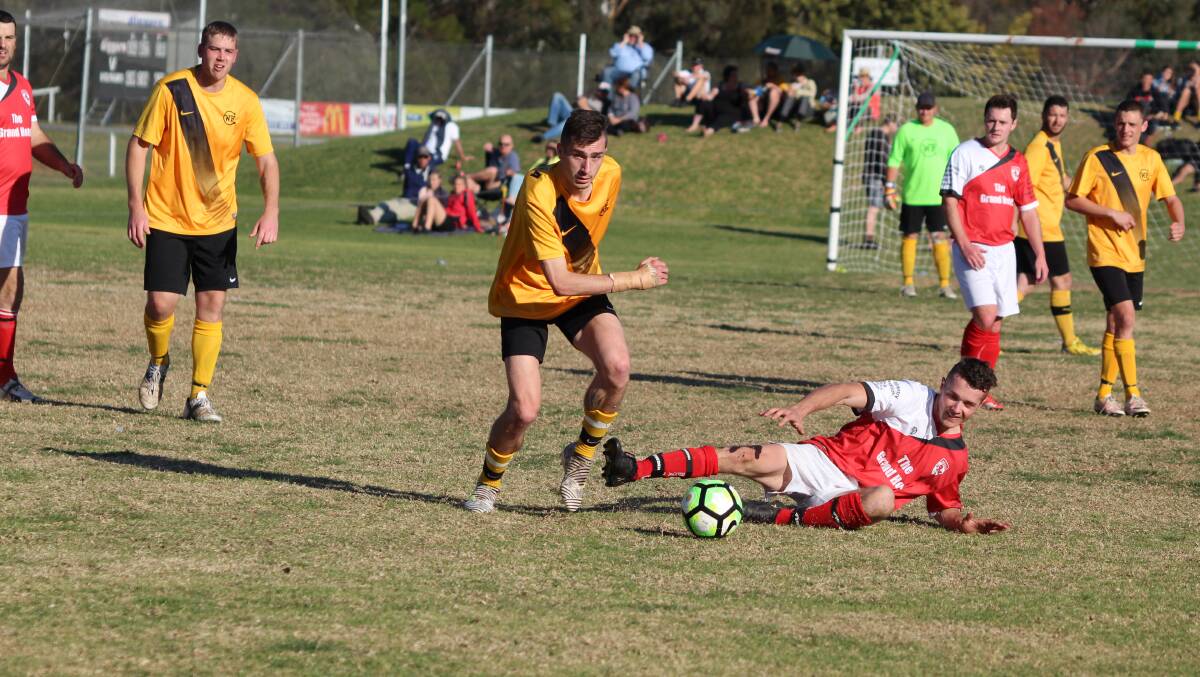 The Wolumla Tigers and Bega Devils, pictured clashing in last year's grand final, fought out a fantastic 1-1 draw at George Griffin Oval on Sunday. 