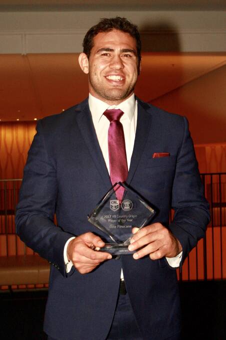 Beaming: Dale Finucane accepts the award as the Country Origin Player of the Year. 