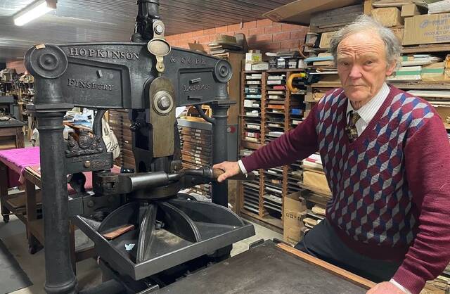 Freshly inked: Richard Jermyn at work in his self-described 'working museum of printing history', which will be part of Art Month in August. Picture: supplied. 