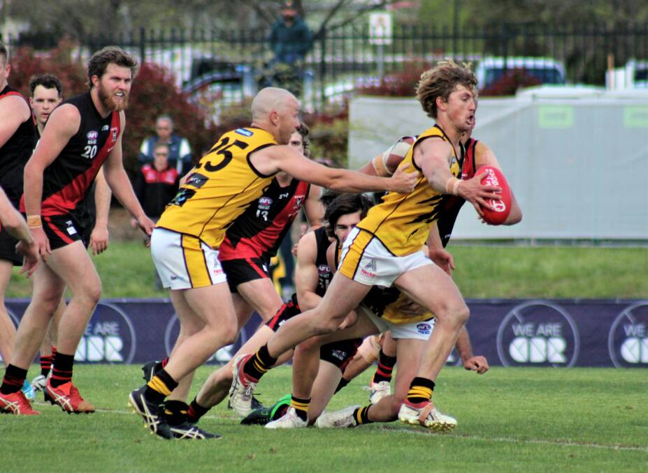 Clearing out: Kel Evans gets the ball out clear from a big pile-up in play in the grand final. Picture: Danny Webster - Queanbeyan Tigers. 