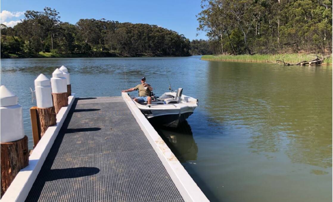 fixed height: Chris Sparks' boat docked at the new jetty shows the height challenge wheelchair users face. Picture: supplied. 