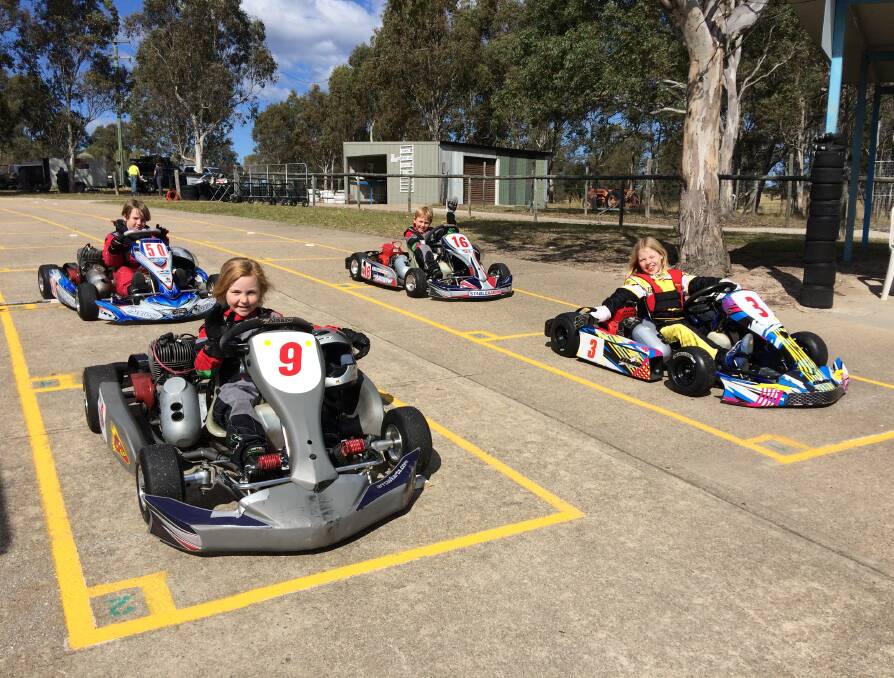 Burning rubber: Junior kart racers Lawson Creed and Zach Munckton (back) with Ava Munckton and   Lana Aylen during a meet this month. 