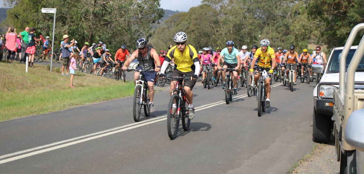 Quick start: Riders storm off the line at the start at the Tarraganda fire shed during last year's Bega to the Beach 30km bike ride.