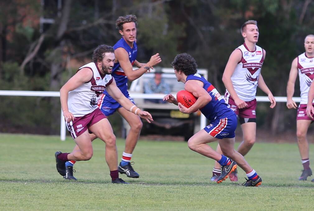 Tom Lipsham eyes up his Merimbula opponent during Tathra's 20-point loss to the Diggers on Saturday. 
