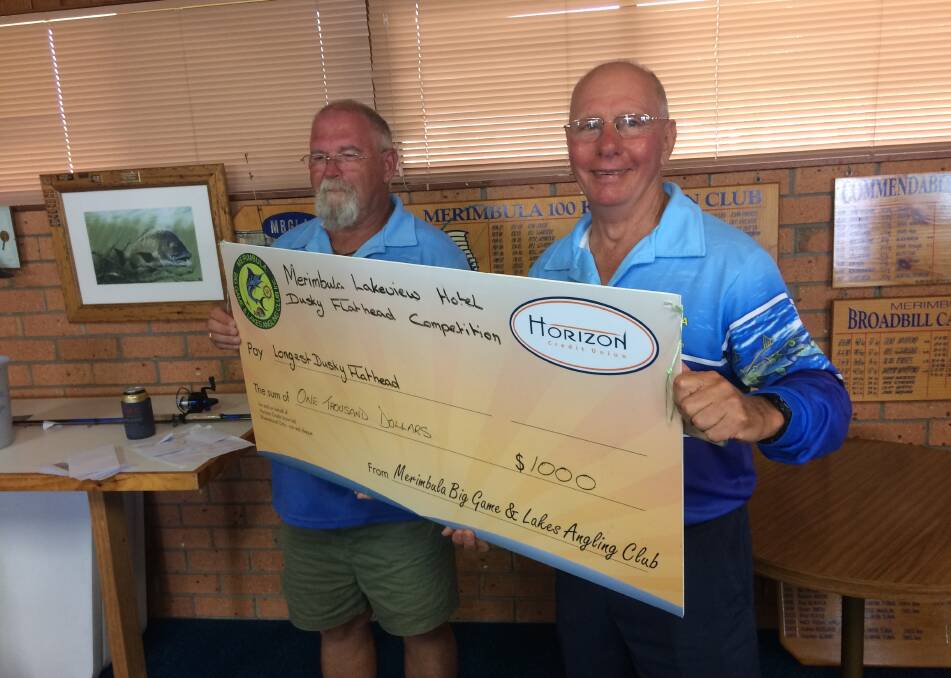 Catch-and-release comp: Herbert Betar of Tura Beach receives his $1000 prize  from club president Lindon Thompson after winning the annual Merimbula Lakeview Hotel Dusky Flathead competition.  
