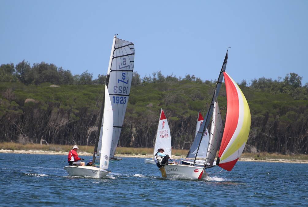 Neck and neck: Josh and Jarrah Dorrough level pegging with Rob and Sian Morton around the buoy of race one. 