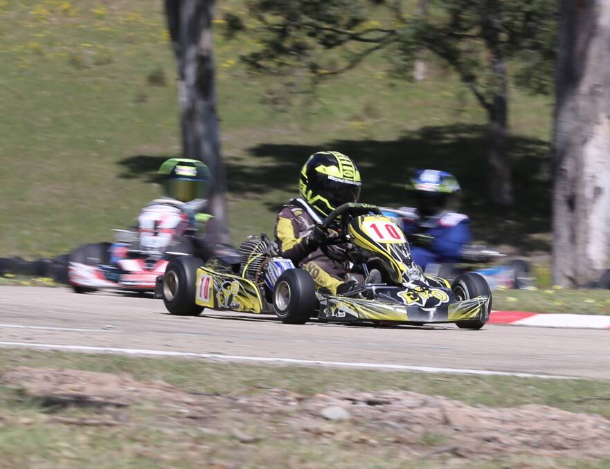 Sapphire karter Aidan Williams leads some rivals toward the home straight during a heat of the Karting Australia NSW titles at the club on Saturday.