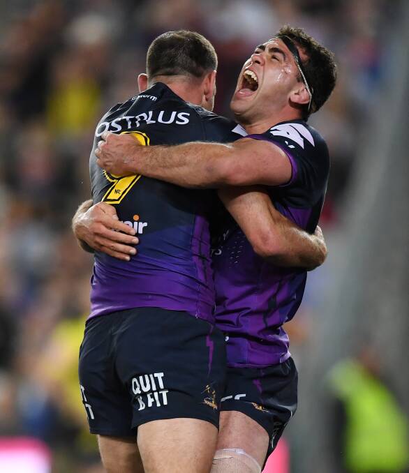 Cheering: Celebrating a grand final win with Cameron Smith, Dale Finucane has another reason to cheer with his selection for an Extended Blues training squad. 