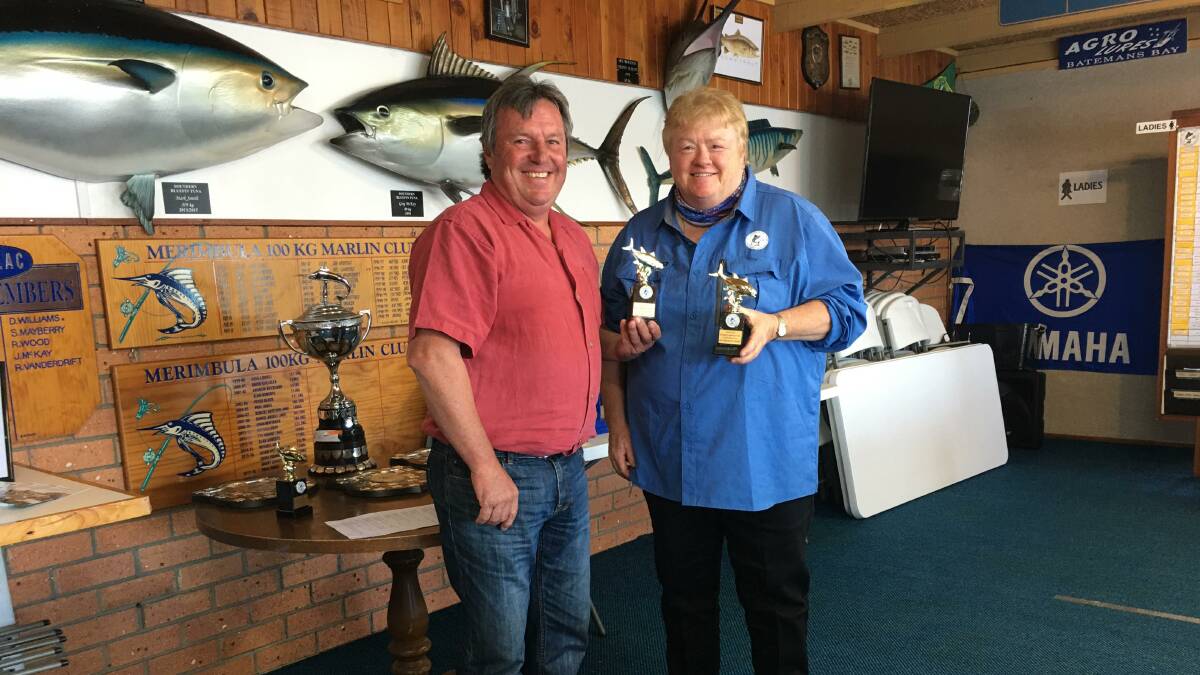 In the MBGLAC Clubhouse Paul Jones presents Heather Sutterby with some of her outstanding Game Fishing Awards.