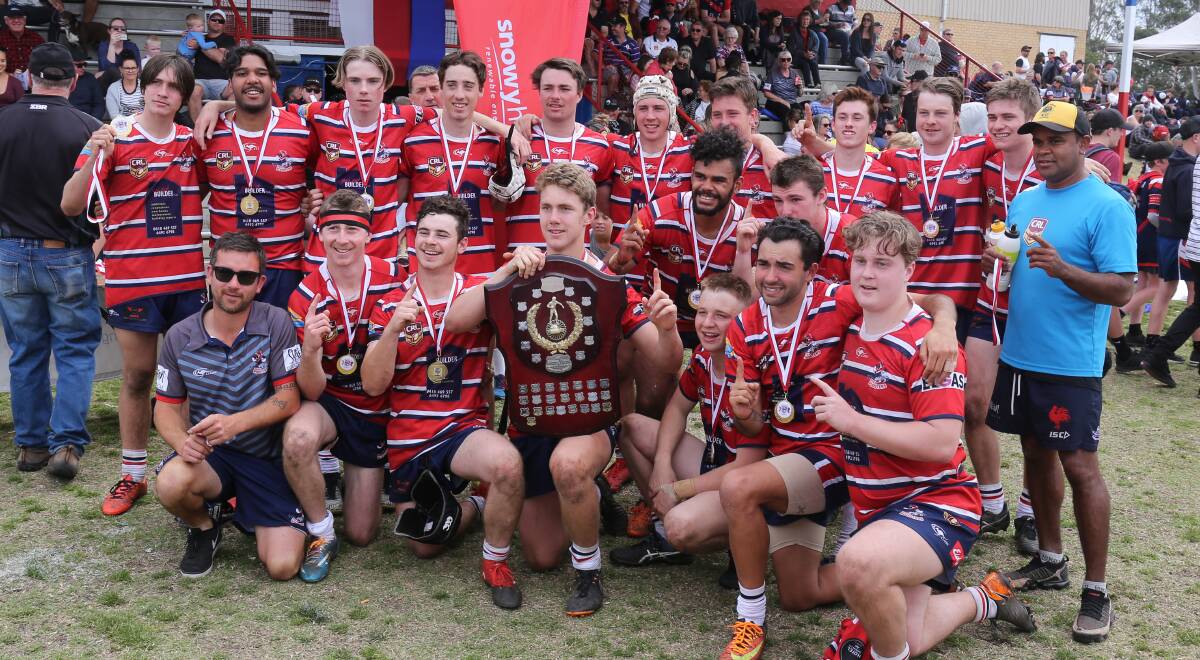 Premiers: The Bega Roosters under 18s celebrate with the premiership shielding after a 28-18 win over Narooma. 