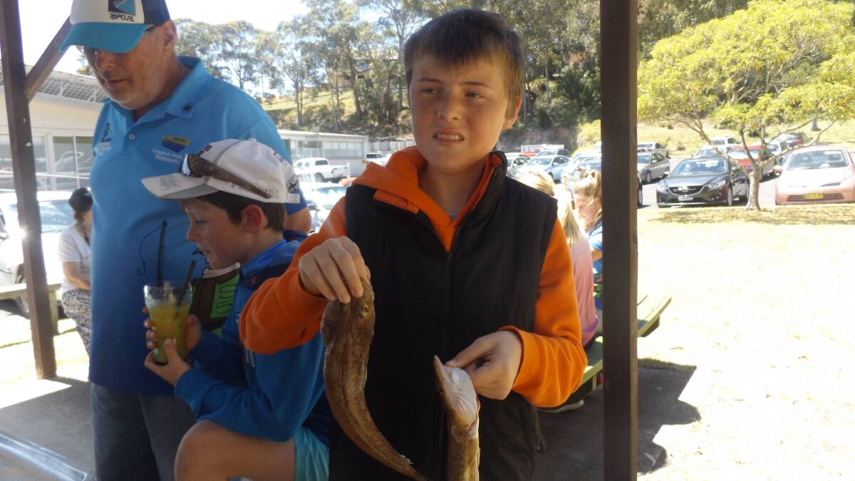 Narooma Bowlo Fishing Club junior member Tom Smart with his two flathead. Tom managed a double hook-up on the last drop of what was his first trip on Sea Eagle. 
