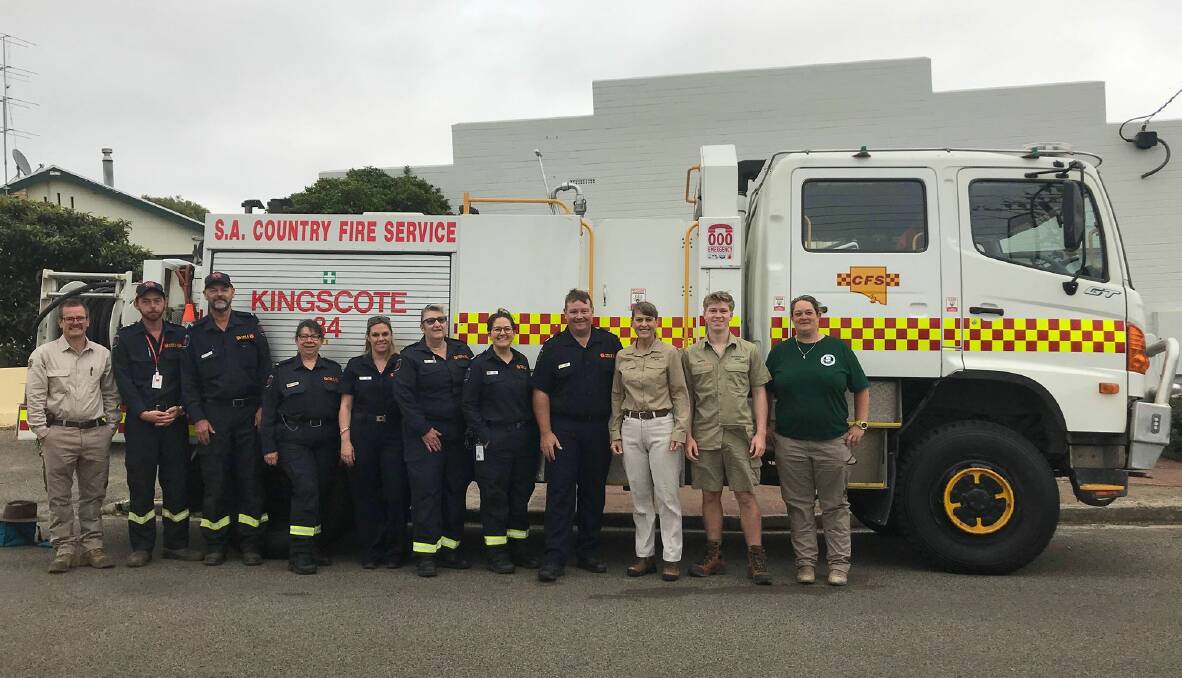 Terri and Bob Irwin at the CFS incident management team headquarters in Kingscote, firefighters and the Kingscote 34 fire appliance. 