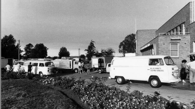 Flashback to 1977 and Canberra's milkos line up in their Kombis outside the factory. Picture supplied
