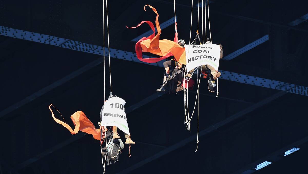 Greenpeace protesters at the Sydney Harbour Bridge on Friday morning. Picture: Nick Moir